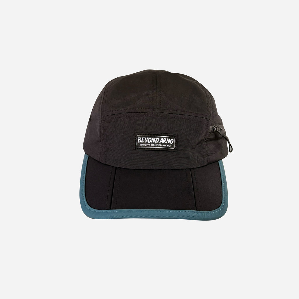 Beyond Arno foldable trail cap with zipped pocket in teal, front view