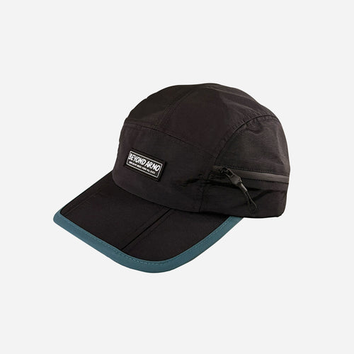 Beyond Arno foldable trail cap with zipped pocket in teal, side view